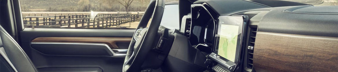 2026 Chevrolet Silverado 1500 steering wheel and instrument panel in Hannibal MO showing driver controls and digital displays