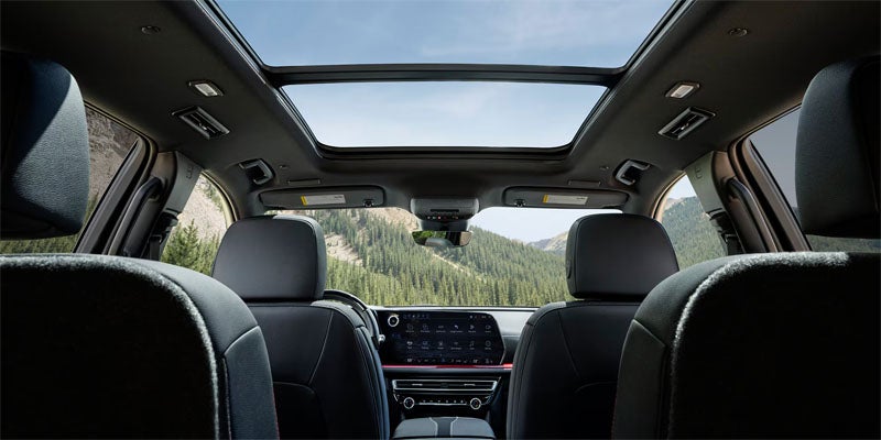 2026 Chevrolet Traverse interior in Hannibal MO showing three-row seating, Smart Slide second-row seats, and spacious cabin for families