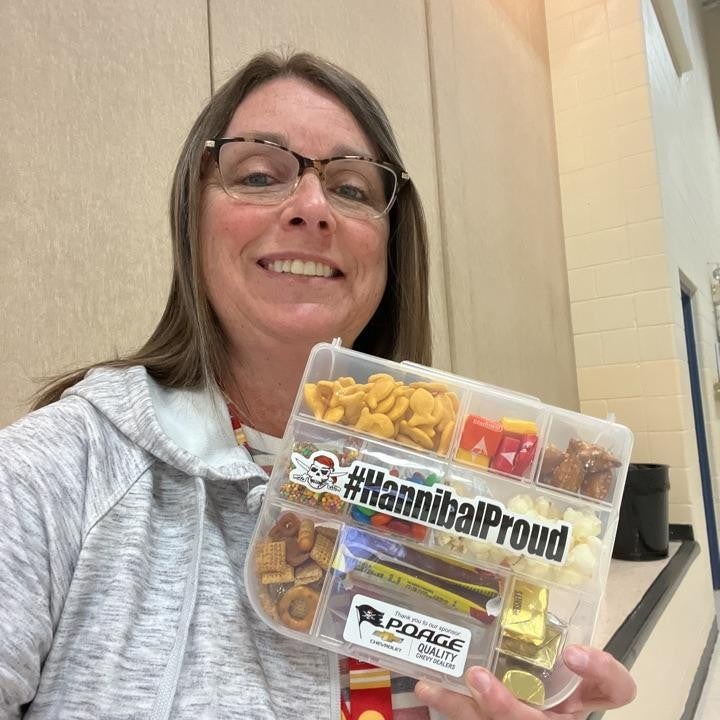 community member holding snack box