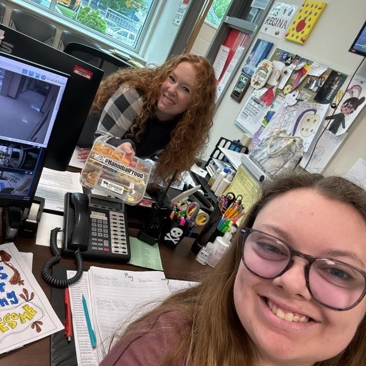 community member holding snack box