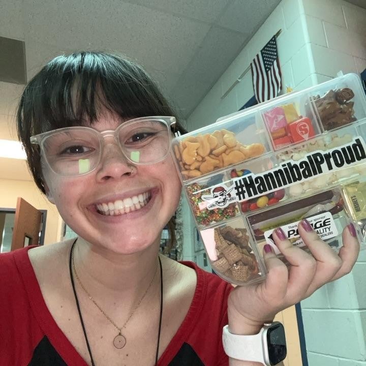 community member holding snack box