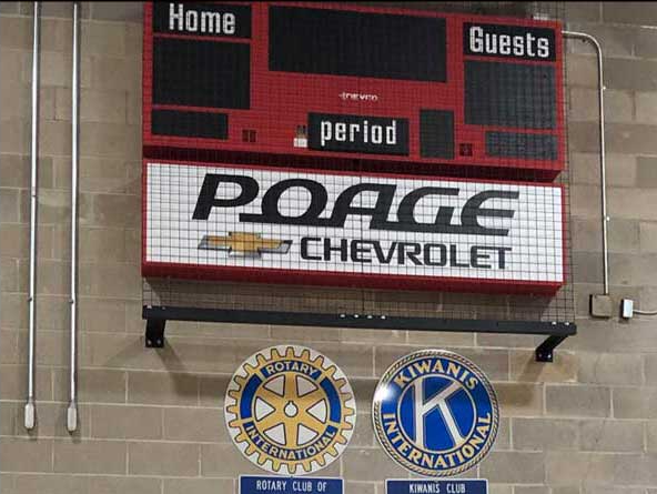 Poage Chevrolet Buick sign under scoreboard at YMCA